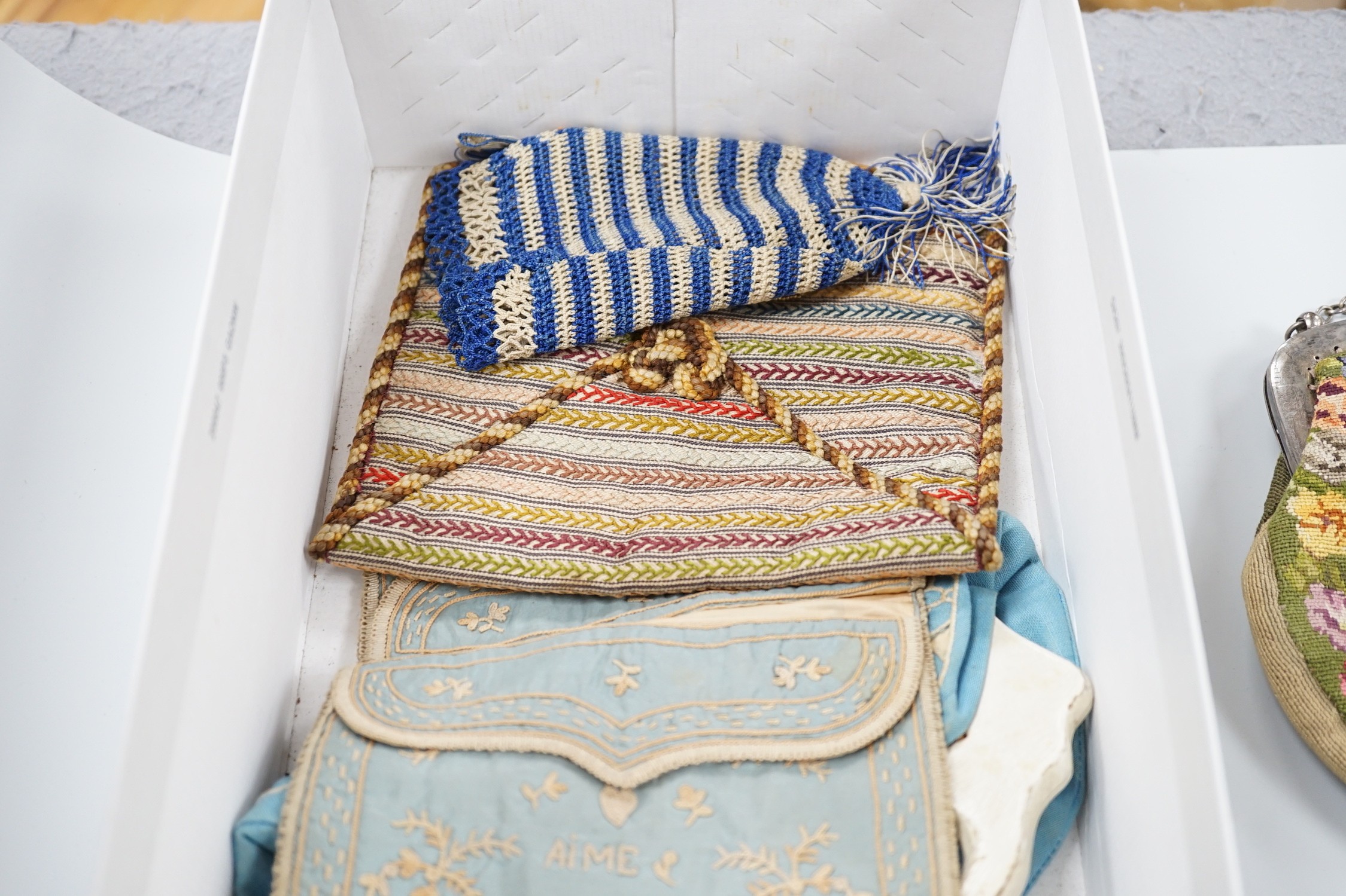 A collection of 19th and early 20th century crochet, embroidered and beaded reticules, evening bags and bible bags